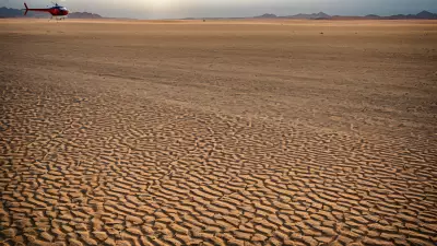 Desert Landscape Vibrant Color Captured in the Bleakness of Sand and Helicopter