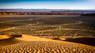 Desert Landscape Vibrant Color Captured in the Bleakness of Sand and Helicopter