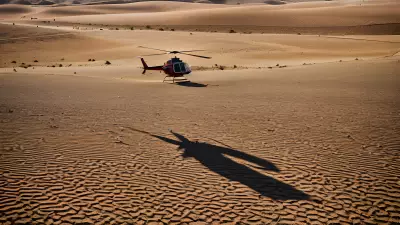 Desert Landscape Vibrant Color Captured in the Bleakness of Sand and Helicopter