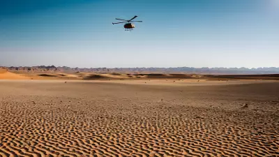 Desert Landscape Vibrant Color Captured in the Bleakness of Sand and Helicopter