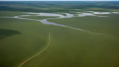 Migration in Motion Aerial Shots of Protagonist George Lambert in the Floodplain